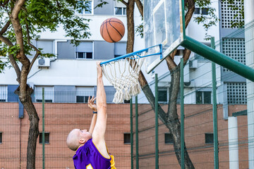 A young basketball player shooting a basketball