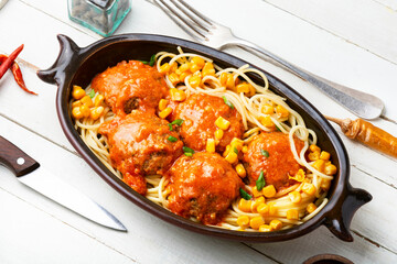Vegetarian cutlets and spaghetti.