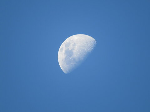 day moon with blue sky