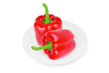 Red pepper on a white plate on an isolated white background.