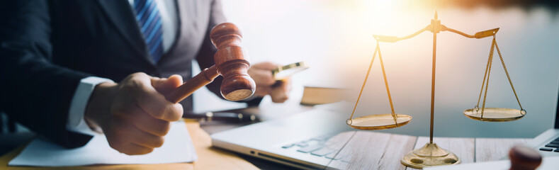 Business and lawyers discussing contract papers with brass scale on desk in office. Law, legal...