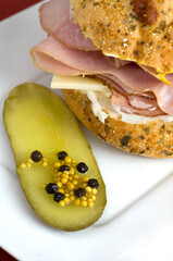 Delicious Ham and Cheese Sandwich on Italian Cheese Bun with Dill Pickle