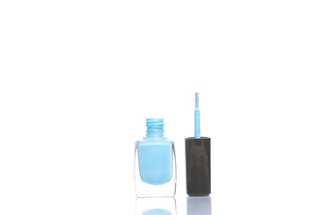 Blue nail polish bottle isolated on white background with reflection
