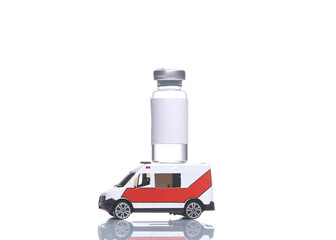 Miniature ambulance with bottle of vaccine isolated on white background with reflection