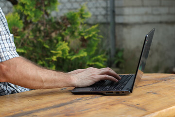 person typing on a laptop