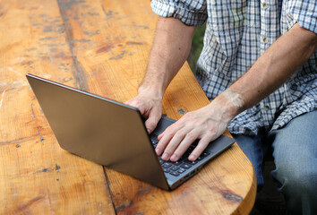 person typing on a laptop