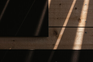 Background of old wooden boards on which the rays of the spring sun shine