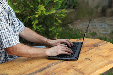 person typing on a laptop