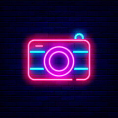 Photo camera neon icon. Electronics store signboard. Shiny effect banner. Vector stock illustration