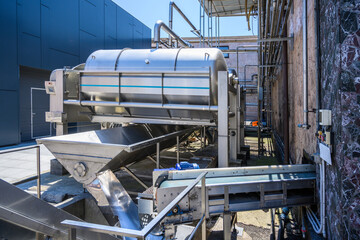 Wine steel tanks, equipment of contemporary winemaker factory.  Barrels for wine storage.