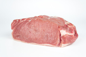 Raw beef with seasoning on white background.