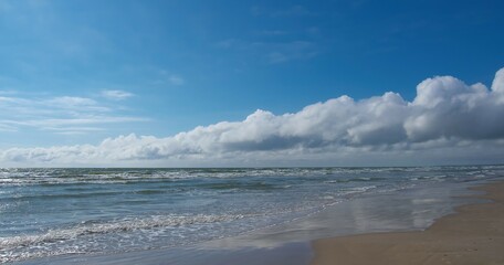 Seascape of the Baltic Sea. Clouds divided the sky.