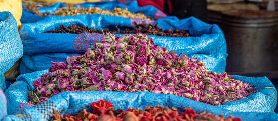 Pink rosebuds used for flavor on sale in souk market in Marrakesh, Morrocco. 