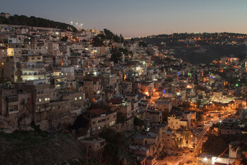 Fototapeta na wymiar Arab neighborhoods in Jerusalem at night. Gehenna valley