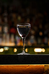 Aviation, drink with gin, lemon juice, maraschino liqueur and violet cream liqueur standing on bar counter.