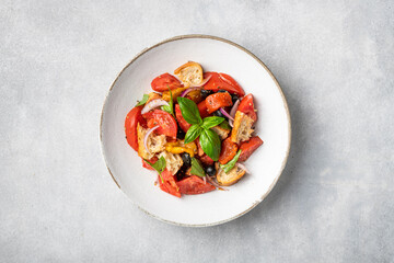 Italian panzanella salad with tomatoes and bread, view from above