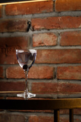 Aviation, drink with gin, lemon juice, maraschino liqueur and violet cream liqueur standing on bar counter.