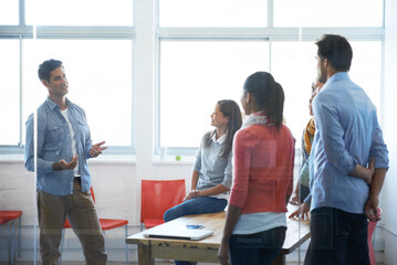 Theres no better work than teamwork. Shot of a group of casually dressed businesspeople in the office.
