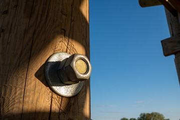 Heavy bolt nut in the wood