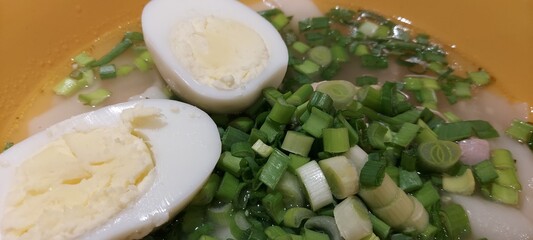 ramen with egg, herbs, noodles. Close-up. Soup.