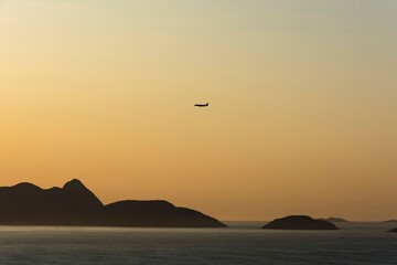Airplane flying over Guanabara Bay - Rio de Janeiro, Brazil.