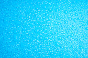 Water Drops On Blue Background.