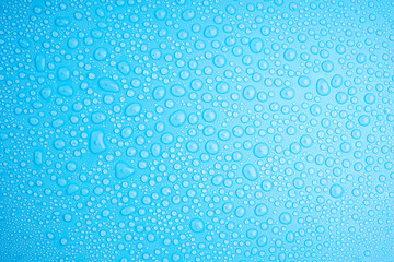 Water Drops On Blue Background.