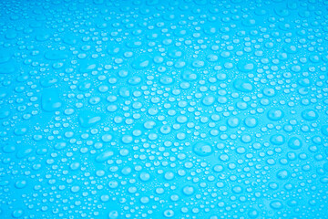 Water Drops On Blue Background.