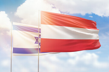 Sunny blue sky and flags of austria and israel