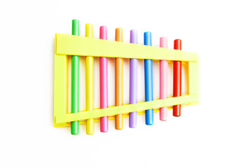 Rainbow Colored Wooden Toy 8 tone Xylophone glockenspiel isolated on white background with clipping path. toy glockenspiel made of metal and wood. Music, vibrant. Rhythm, listen. Copy space