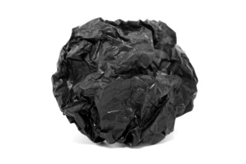 Paper. Crumpled ball of black paper on a white background