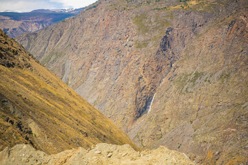 View from mountain pass Katu-Yaryk of waterfall, which falls from a cliff in, Altai, Russia