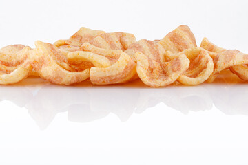 Chips salty bacon snack close up, on white background. Top view.