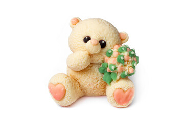 Teddy bear with flowers figurine made of mastic. Sweet decor for a birthday cake. Kids toys. Decor for Easter decorations. Sweet figurines for kids.