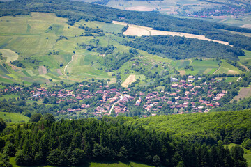 Fototapeta na wymiar A small village between hills in Transylvania - Romania