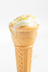 ice cream cone on white background and sugar particles on it