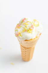 ice cream cone on white background and sugar particles on it