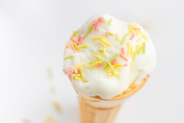 ice cream cone on white background and sugar particles on it