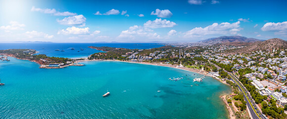 Aerial panorama of the beach at Vouliagmeni, south Riviera coast of Athens, Greece, with emerald,...