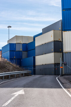 Gothenburg, Sweden - April 03 2022: Tall Stacks Of Grey And Blue Shipping Containers.