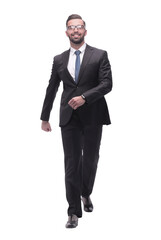confident young businessman moving forward. isolated on white