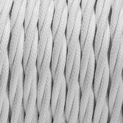 Colorful braided and shilded cable texture background. Closeup with visible texture