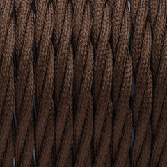 Colorful braided and shilded cable texture background. Closeup with visible texture