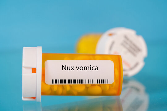 Nux vomica. Nux vomica pills in RX prescription drug bottle