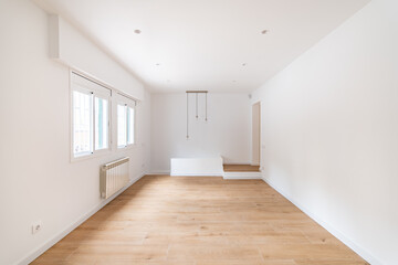 Empty apartment room with wooden floor in a new flat for rent