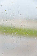 Window with raindrops bokeh