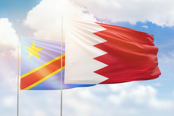 Sunny blue sky and flags of bahrain and dr congo
