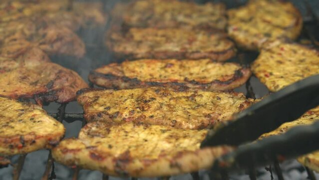 Spicy Pork Beef Bacon Being Grilled Over Bright Glowing Coals Broasting On Fire. Lunch celebration Party Barbecue. Outdoor Cooking. Cook Prepares Oriental Dish In Kitchen. Junk Food, Healthy Lifestyle