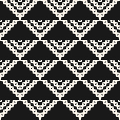 Vector monochrome geometric ornament in ethnic style. Abstract seamless pattern with simple elements, triangles, squares, chevron. Tribal background texture. Folk motif. Black and white repeat design