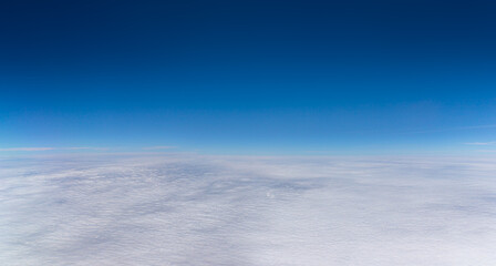 Fototapeta premium Blue Sky on top with white fluffy clouds on the bottom